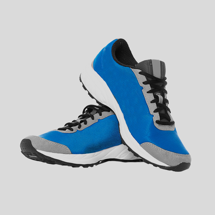 A pair of running shoes, tinted blue